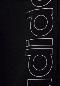 adidas Performance UNISEX - Pantalon de survêtement - black/white