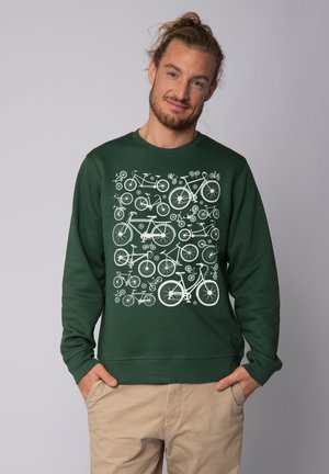 Green sweatshirt with long sleeves and a crew neck, featuring a white bicycle pattern across the front. Smooth texture and relaxed fit.