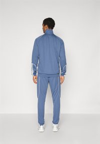 adidas Sportswear STADIUM SET - Træningssæt - preloved ink/off white