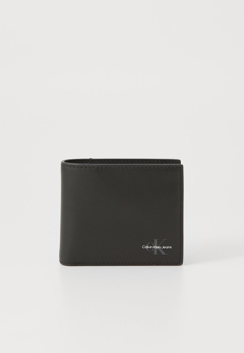 Black leather bifold wallet with smooth texture, featuring a subtle embossed logo and clean stitching. Compact, rectangular design.