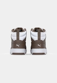 Brown and white high-top sneakers with a padded collar, textured upper, flat laces, and white rubber sole featuring brand logo.
