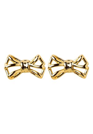 Paire de boucles d'oreilles en métal doré brillant en forme de nœud avec un design géométrique ouvert sur fond blanc.