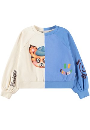Bluza dresowa podzielona na kremową i niebieską, na przodzie twarz kota w niebieskiej czapce, na niebieskiej stronie napisy „Be Curious”, kursywą „Curiosity” i uśmiech na rękawach.