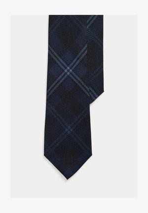 Gravata azul-marinho com padrão xadrez em tons de azul escuro e claro. Apresenta ponta pontiaguda e textura de tecido suave.