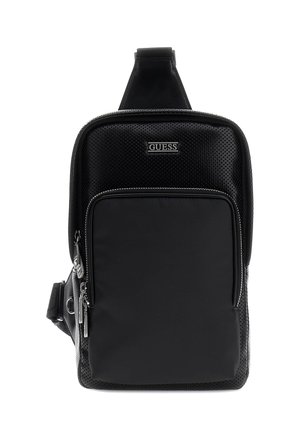 Sac bandoulière noir GUESS avec texture perforée, poche avant zippée et bandoulière réglable.