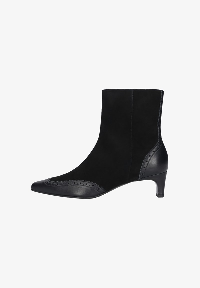 Zwarte enkellaars van glad leer en suède met een spitse neus, decoratieve brogue details en een hak van 5 cm.