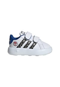 White sneaker with blue accents, featuring velcro straps, black spider web design on the side, and a circular logo on the heel.