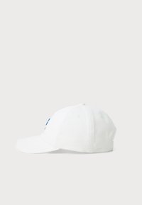 White baseball cap made of cotton with a curved brim, featuring blue embroidered lettering on the front and eyelet vents.