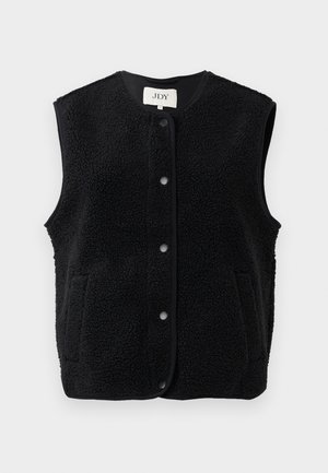 Fekete bolyhos mellény texturált felszínnel, kerek nyakkal, elülső patentgombokkal és két oldalsó zsebbel. sima szegéllyel van körberakva.