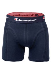 Temno modri bokserici iz mehkega materiala z logotipom Champion na temnem pasu, ki imajo udoben, oblikovan kroj in ravne šive.