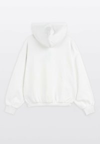 Bluza z kapturem wykonana z białej bawełny. Charakteryzuje się luźnym krojem, ściągaczami na mankietach oraz marszczonym pasem. Gładka tekstura z minimalistycznym wzornictwem.