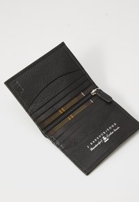 Black leather wallet with a textured surface, featuring card slots, a zippered compartment, and embossed branding on the interior.