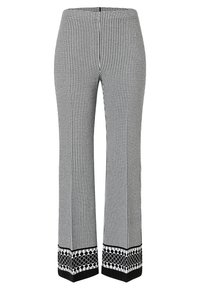Schwarz-weiß karierte Hosen mit einem ausgestellten Schnitt. Die Bündchen haben ein auffälliges geometrisches schwarz-weißes Muster. Glattes Material.