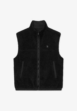 Sort fleecevest med høj krave, lynlås foran og to sidelommer. Har en blød tekstur og et minimalistisk design.