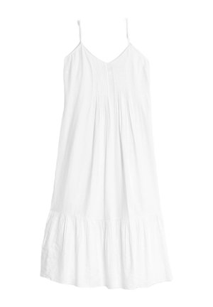 Abito bianco senza maniche realizzato in tessuto leggero, con corpino plissettato e orlo svasato e arricciato. Texture liscia su tutta la superficie.