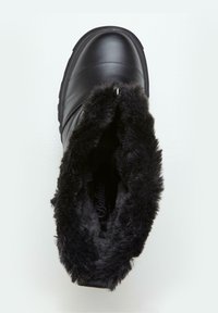 Black waterproof ankle boot with a smooth leather exterior, plush black faux fur lining, and a rubber sole, featuring a sleek design and metallic accent.
