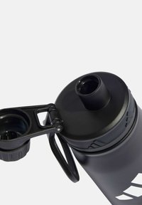 Black sports water bottle with a flip-top lid, featuring a textured body, sturdy handle, and a prominent logo in white.
