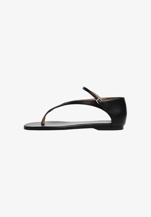 Sandale negre din piele cu talpă plată, având un design cu curea T și o curea ajustabilă la gleznă pentru o fixare sigură.Textură netedă și stil minimalist.