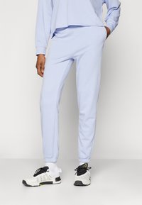 Under Armour - RIVAL TERRY JOGGER  - Tracksuit bottoms - celeste/white Thumbnail Image 1