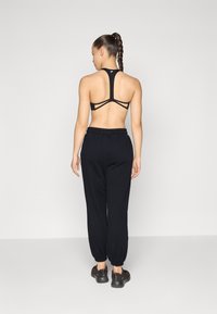 Jogger Fabletics Feel Good Performance Femme 3X Noir - Taille Plus Très Bon État