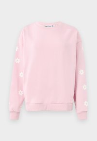 Ljusrosa sweatshirt med rund hals, långa ärmar och vita prästkragar på ärmarna. Tillverkad av mjukt bomullsblandat material.