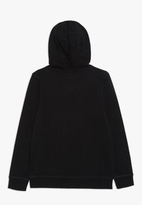 Felpa nera a maniche lunghe mostrata sul retro con polsini e orlo a coste, esposta su uno sfondo bianco.