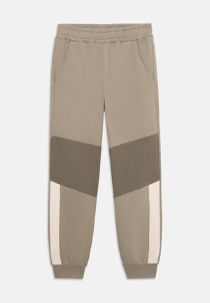 Pantaloni felpati leggeri in beige, con pannelli a blocchi di colore in verde scuro e rosa tenue. Vita elastica con tasche laterali.