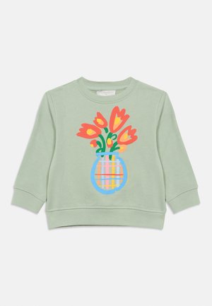 Φόρμα παιδική ανοιχτό πράσινη με πολύχρωμο γραφικό με πορτοκαλί τουλίπες σε ριγέ μπλε βάζο μπροστά.