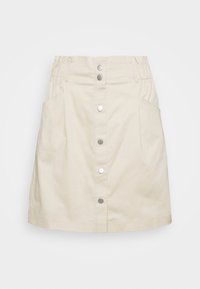 Beige bomullskjol med raka linjer, med knäppning fram med knappar och två sidofickor. Elastisk midja för justerbar passform.