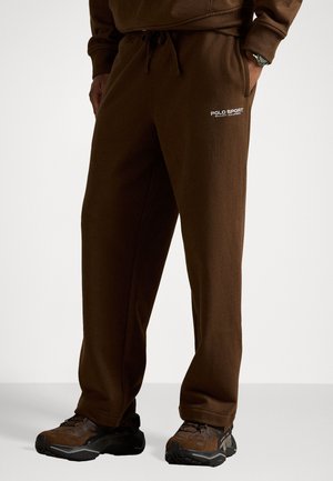 Brune joggebukser med en avslappet passform, med regulerbar snor i livet og brodert "POLO SPORT"-logo i hvitt på låret.