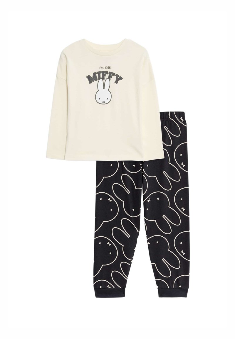 Twee-delige pyjama set bestaande uit een crèmekleurige long sleeve top met een Miffy graphic en zwarte broek met een wit konijnenpatroon. Zacht katoen.