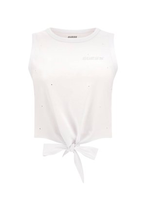 Hvid crop top med ærmeløs design, der har en bindebånd i taljen og spredte sorte dekorationer. Logoet er trykt i sølv på brystet.