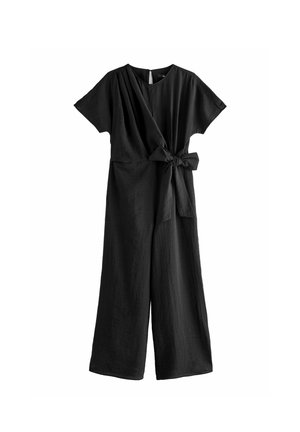 Black jumpsuit featuring a wrap design, short sleeves, a tied waist, and wide legs. The fabric appears textured and lightweight.