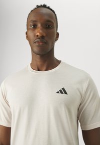 adidas Performance TR-ES FR T - Sport T-shirt - putty mauve/black