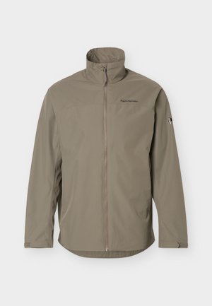 helepruun lukuga jakk kõrge krae, pikad varrukad ja väikesed logod rinnal ning vasakul varrukal.