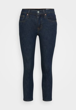 Tumši zili džinsi ar slaidu piegriezumu, ar vara detaļām, divām priekšējām kabatām un smalku šuvju detaļām. Tīrs, mūsdienīgs dizains.