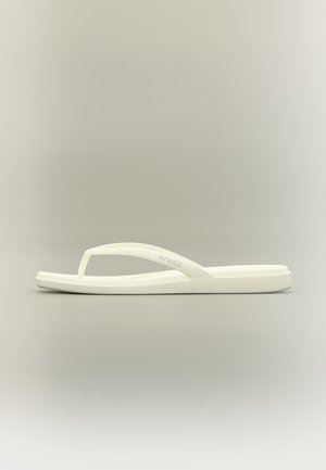 Single off-white rubber flip-flop with triangular toe post and strap featuring embossed "Crocs" logo, shown from side view on neutral background.