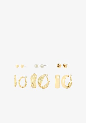 Set of gold earrings including studs, hoops, and intricate designs. Features heart-shaped, pearl, twisted, and smooth styles.