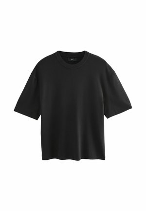 T-shirt noir à manches courtes en tissu doux, avec un col rond et une coupe décontractée, sans motifs ni graphismes visibles.