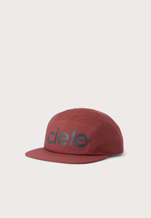 Red five-panel cap with black "ciele" logo on front and mesh fabric on side panels, displayed on plain white background.