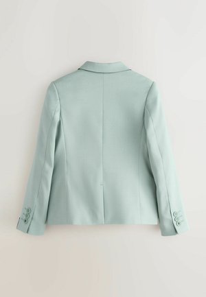 Lyseblå blazer med skarpe reverser, figursyet pasform og lange ærmer. Har tre knapper på hver manchet og glat stoftekstur.