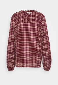 Blouse bordeaux à manches longues avec un motif à carreaux crème. Dotée d'un col smocké et d'une patte de boutonnage à l'avant. Tissu à la texture douce.