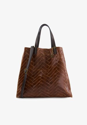 Brown leather tote bag with a woven texture, featuring dark brown handles and a detachable shoulder strap. Gold charm accent.