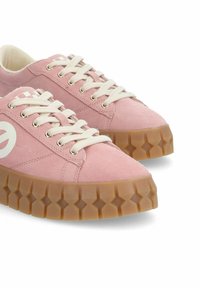Pink suede sneakers with white laces and logo, featuring a textured gum rubber sole with a diamond pattern.