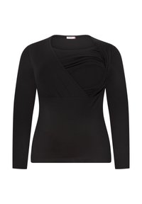 Black long-sleeve top with a wrap-style front and textured draping detail across the chest. Soft, stretchy fabric, fitted silhouette.