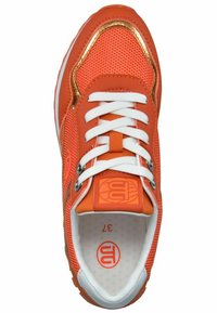 Orange sneaker with mesh and synthetic upper, white laces, padded tongue, and gold-tone accents. Features a patterned sole and logo detail.