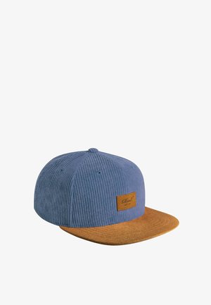 Blue corduroy cap with a brown suede flat brim and a small brown leather patch on the front side.