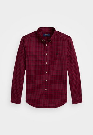 Raudona ir tamsiai mėlyna languota marškinėlių palaidinė su ilgomis rankovėmis, apykakle ir nedideliu šilkografijos logotipu dešinėje krūtinės pusėje.