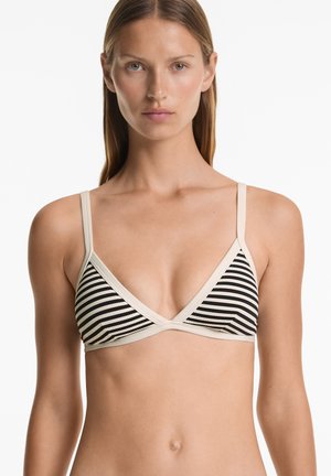 Svart och krämfärgad randig bikiniöverdel med en triangulär design, som har tunna band och en kontrasterande helfärgad kant längs kanterna.