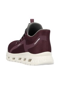 Maroon athletic shoe with mesh upper, padded collar, and a white rubber sole featuring angular cutouts for ventilation. Black and gray laces.